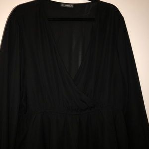 Black crossover blouse with lace bell sleeves